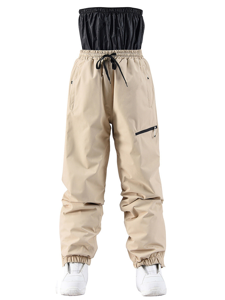 Beige pants with black top section on a white background