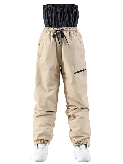 Beige pants with black top section on a white background