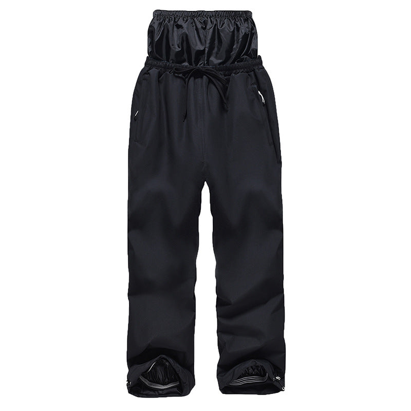 Black snow pants on a white background