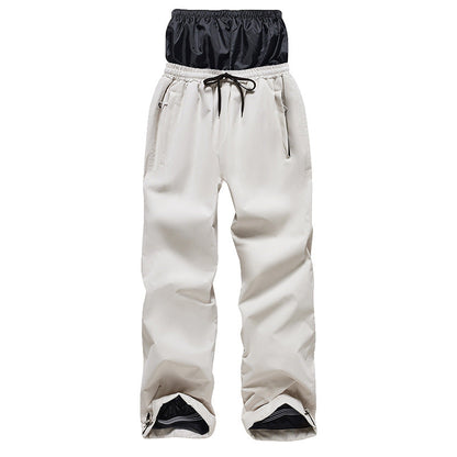 White snow pants with a black waistband on a white background