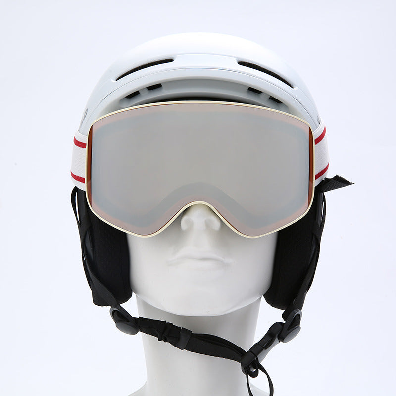 White helmet with goggles on a mannequin head against a white background