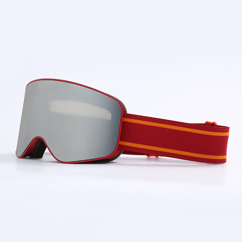 Gray goggles with a red and orange striped strap on a white background