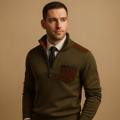 Man wearing a green sweater with brown accents on a beige background