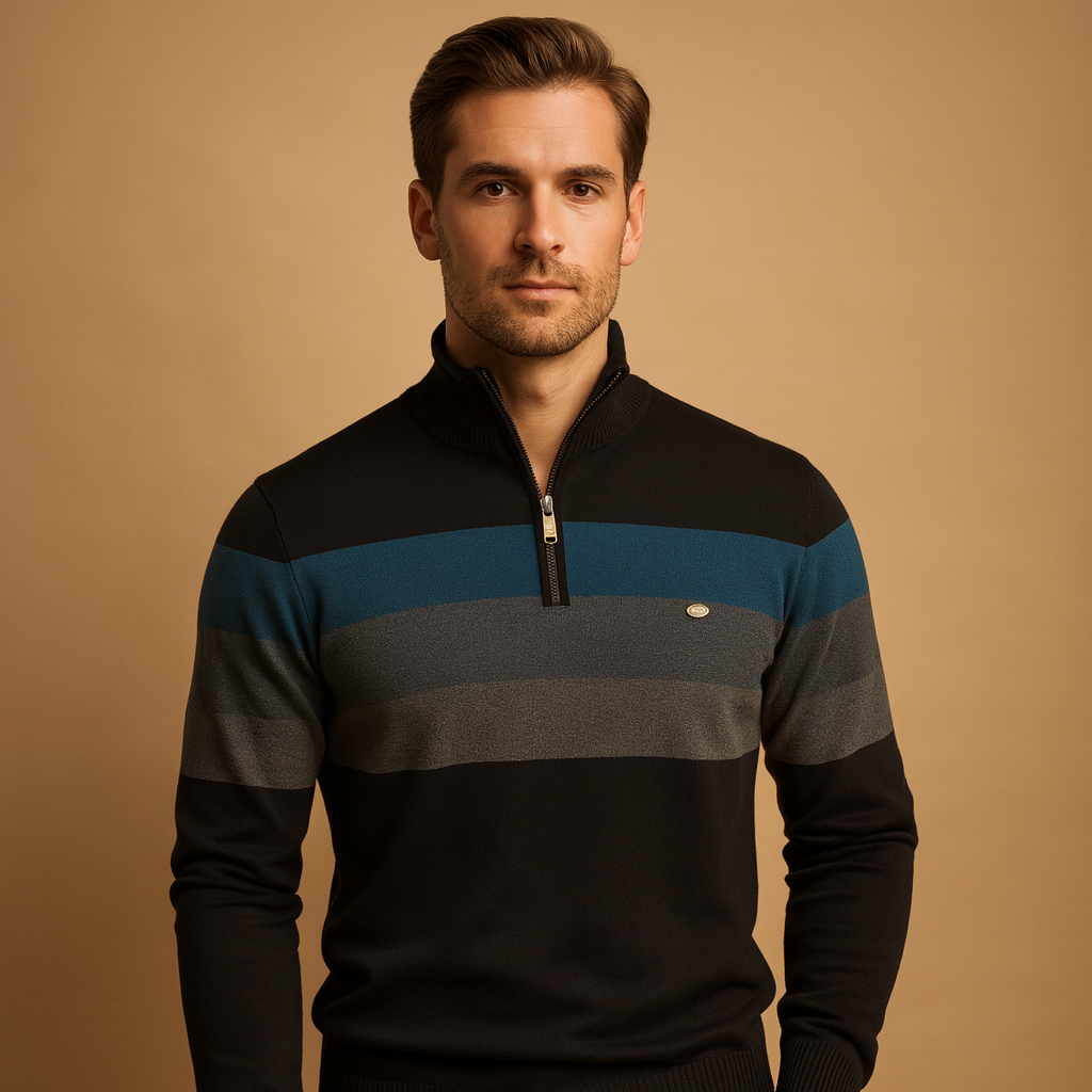 Man wearing a black, blue, and gray striped sweater against a beige background
