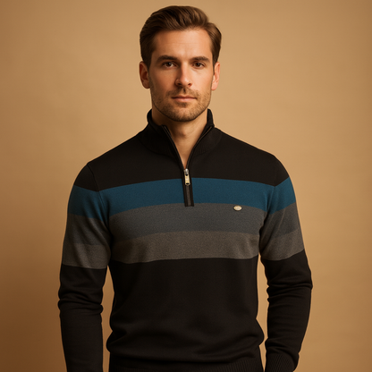 Man wearing a black, blue, and gray striped sweater against a beige background