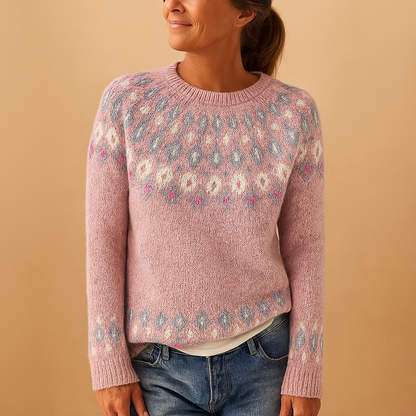Woman wearing a pink patterned sweater against a beige background