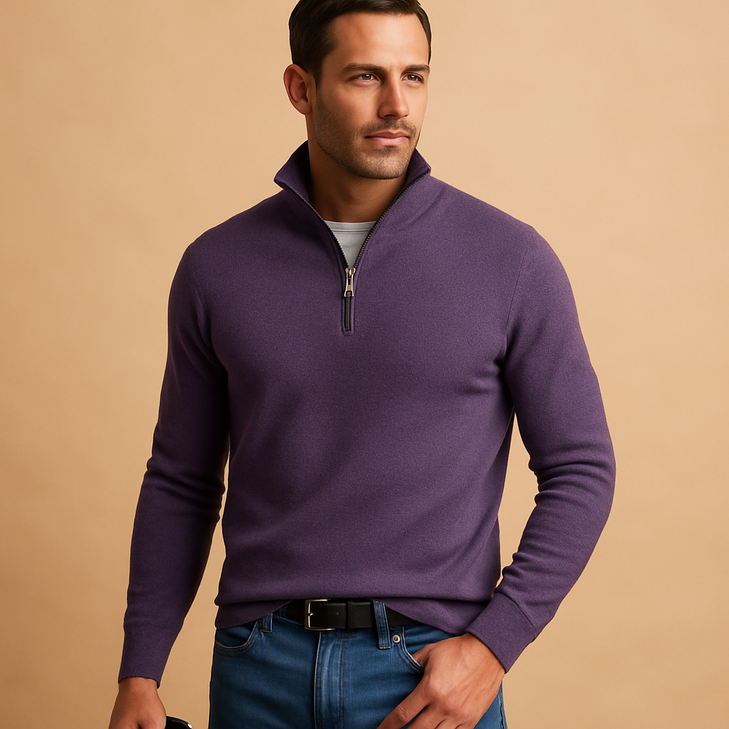 Man wearing a purple quarter-zip sweater against a beige background